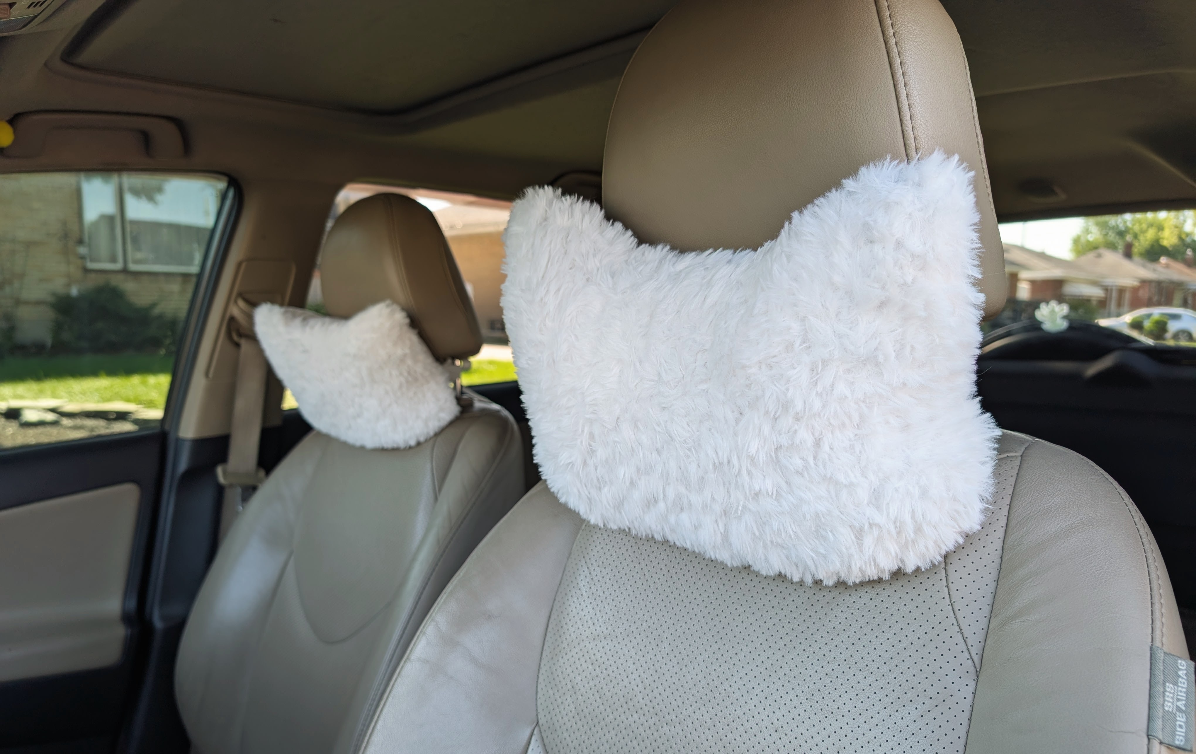 Fluffy car pillows.